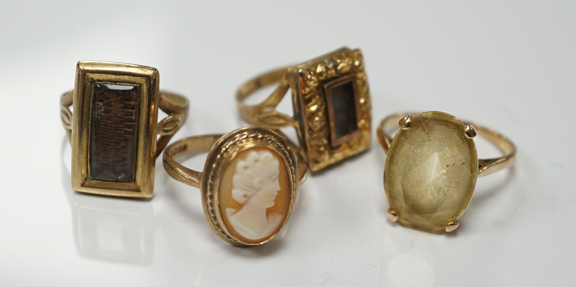 Two 19th century yellow metal mourning brooches, now with shanks converted to dress rings and two other 9ct rings.